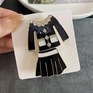 Elegant Black and Gold Brooch